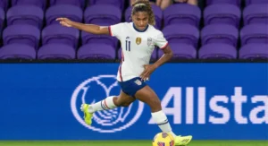 Team USA women's soccer star, Catarina Macario kicking the ball