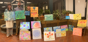 Member of the Western New York Community came together to paint "Welcome" signs in the languages of New Americans.