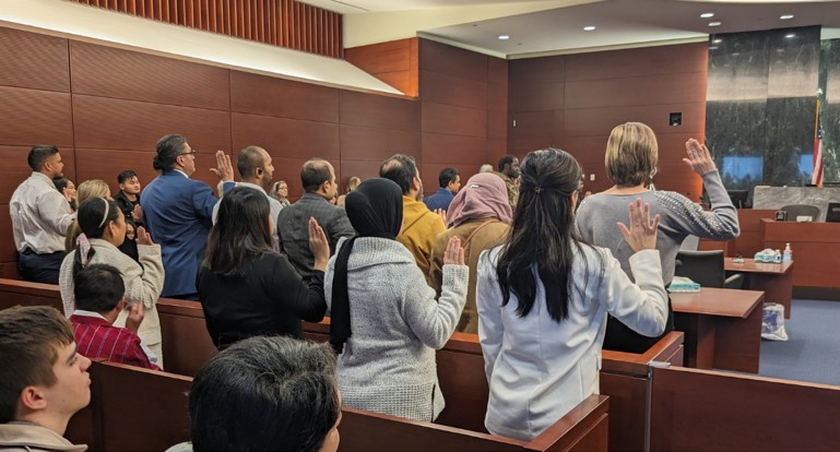 People taking the oath of naturalization.